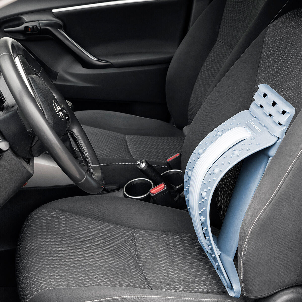 Soporte corrector de estiramiento lumbar con puntos de presión y magnéticos Lumport sobre el asiento del coche